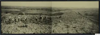 Panoramic view of the acropolis hill at Idalion before excavation, with men working across the stony slope