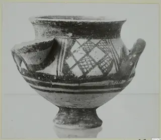 White Painted I bowl with dark painted bands and diamond lattice panels, shown on a pale surface
