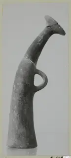 Pottery vessel with a tall, curving neck, flared mouth and loop handle, from the Kastros tombs at Lapithos