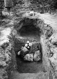 Tomb 4 at Marion, dromos: an excavated cut filled with large rough stones and rounded stones