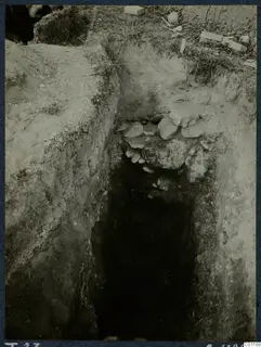 Tomb 23 at Marion during excavation, a narrow cutting with loose stones at the opening