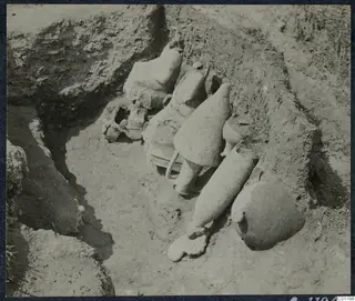 Pottery vessels lying in situ in the excavation of Tomb 30 at Marion, seen from above