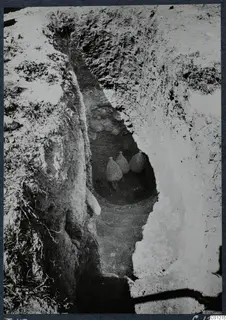 Tomb 43 at Marion: a steep-sided cutting leading down to three vessels at its base