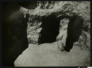 Tomb 16 at Marion during excavation, with a vessel and stones visible in the cut