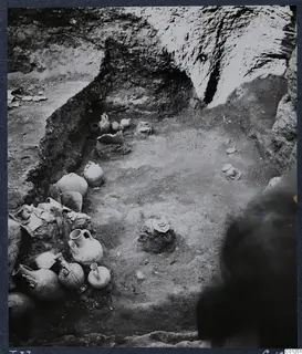 Tomb 37 at Marion during excavation, with pottery vessels lying in situ along the side of the pit
