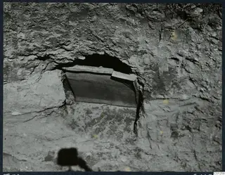 Niche III in Tomb 32 at Marion, unopened, its opening closed by a flat stone slab in a rock-cut wall