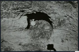 Rock-cut niche in Tomb 32 at Marion, opened, with a small handled vessel lying inside it