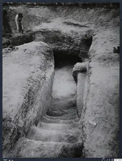 Tomb 37 at Marion: a stepped dromos leading down to the tomb entrance during excavation, with a person at the top.