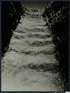 Dromos of Tomb 60 at Marion, a stepped passage cut down between rock faces during excavation.