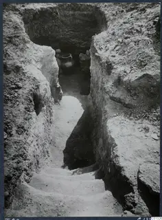 Dromos with steps leading to Tomb 69 at Marion, with pottery vessels visible inside the tomb entrance