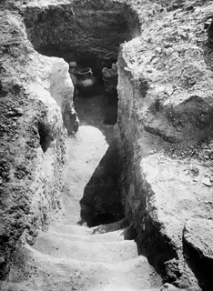 Tomb 69 at Marion seen from the dromos, with steps in the foreground and a large jar inside the tomb opening