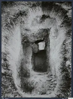 Tomb 74 at Marion during excavation, with a dromos cut into the soil and a blocked tomb entrance.