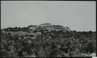 Ruined stone fort on a low hill above scrubland, seen from the north-west at Nitovikla.