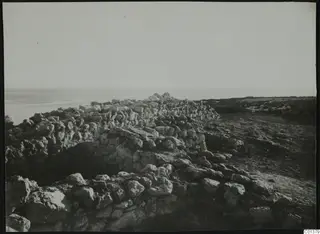 Rough stone wall remains running towards the sea at Nitovikla on the Karpas peninsula