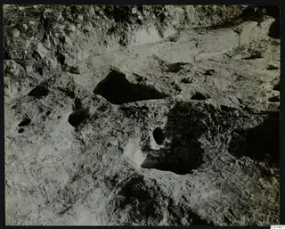 Cult place under Tomb 1 from the north, Palaeoskoutella: rock surface with several hollows cut into it