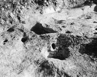Cult place under Tomb 1 at Palaeoskoutella, a cut rock surface with hollows seen from the north