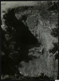 Nitovikla, Karpas Peninsula: excavated cutting in rock and soil, with stones and shrubs around it
