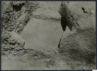 Close view of excavated earth at T.96, Marion, with rough walls and a flat floor in the centre