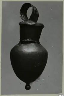 Single pendant with a ribbed suspension loop, a bulbous body and a small ball at the base, shown against a grey backdrop