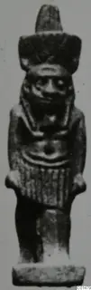 Small standing figurine with a tall headdress, amulet named Nefertum from Marion Tomb 50