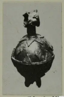 Globular piece of jewellery from Marion with beaded triangular decoration and a knob-like top