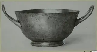 Two-handled silver cup from Vouni, shown in side view against a plain background