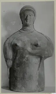 Terracotta bust of a figure with a cap-like headdress and a beaded necklace, from Vouni