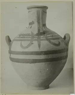 Large two-handled jar with a wide neck, painted with dark horizontal bands and curving motifs, shown against a plain background
