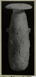 Stone vase from Vouni with a flat disc-shaped rim and two small lug handles, photographed upright