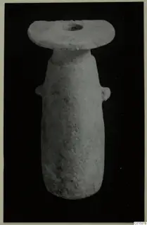 Alabaster vessel from Vouni with a flat disc-shaped mouth and two small lug handles, against black