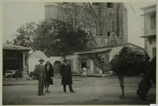 Gudrun Atterman, Erik Sjöqvist and John Lindros with camels on the square outside Lala Mustafa Pasha Mosque