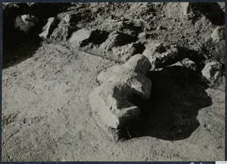 Carved stone find lying partly buried in the soil among rubble stones at Vouni Palace