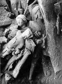 Broken stone sculptures heaped together in the big deposit in the cult room at Kition