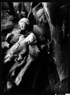 Detail of a heap of broken stone sculptures, bodies and heads, in the cult room deposit at Kition.