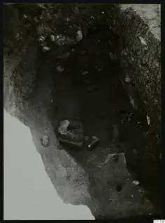 Central pit at Kition seen from above, with stone pieces and small finds lying on the excavated floor