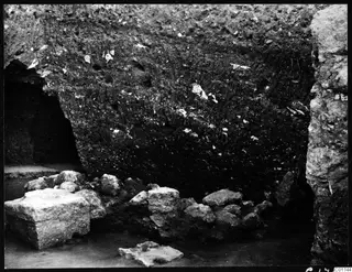 Soil section at the cult room at Kition, with large stones lying at its base