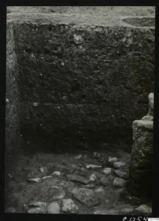 Excavated cult room at Kition seen from the south, with a stone-filled floor and a worked stone block at right