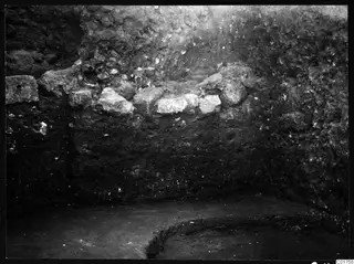Soil profile in the eastern part of the Bamboula at Kition, with pale stones set into the excavated section