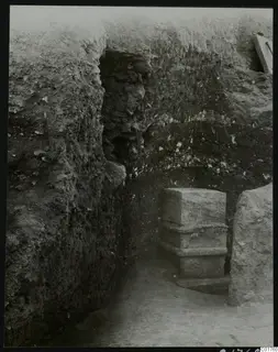 Soil section beside a stone pillar in an excavation trench at Kition