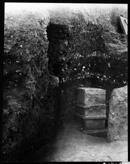 Soil section beside a stone pillar in an excavation trench at Kition