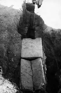 Roman water channel at Kition, covered by large stone slabs in an excavation trench