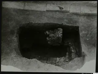 Central pit excavated at Kition, seen from the north, with stones and rubble inside the cut