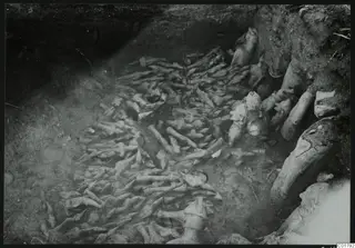 Square L 11 at Ayia Irini, with a dense scatter of figurine fragments lying in situ in an excavated pit