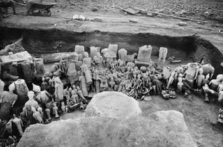 Overall view of an excavated trench at Ayia Irini, with many statues and figurines lying together among the finds.