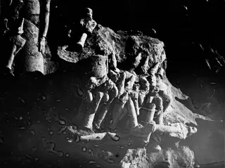 Grid square L 10 at Ayia Irini: pale fragments of figures lying together in the excavated ground