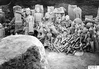Votive deposit at Ayia Irini, western part, with a dense heap of sculptured figures and heads in pale stone