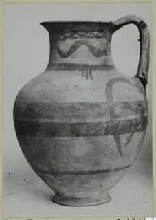 White Painted VI jug with a long strap handle and painted wavy and horizontal bands