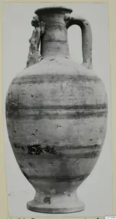 Pottery White Painted VII, a tall one-handled vessel with horizontal bands and a small applied figure on the shoulder