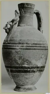 Jug with a modelled human figure on its shoulder, a strap handle and horizontal painted bands on the body