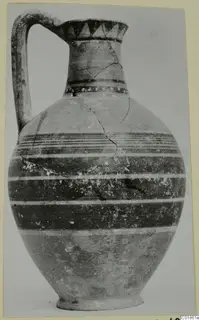 Bichrome-Red pottery jug with a strap handle and horizontal painted bands